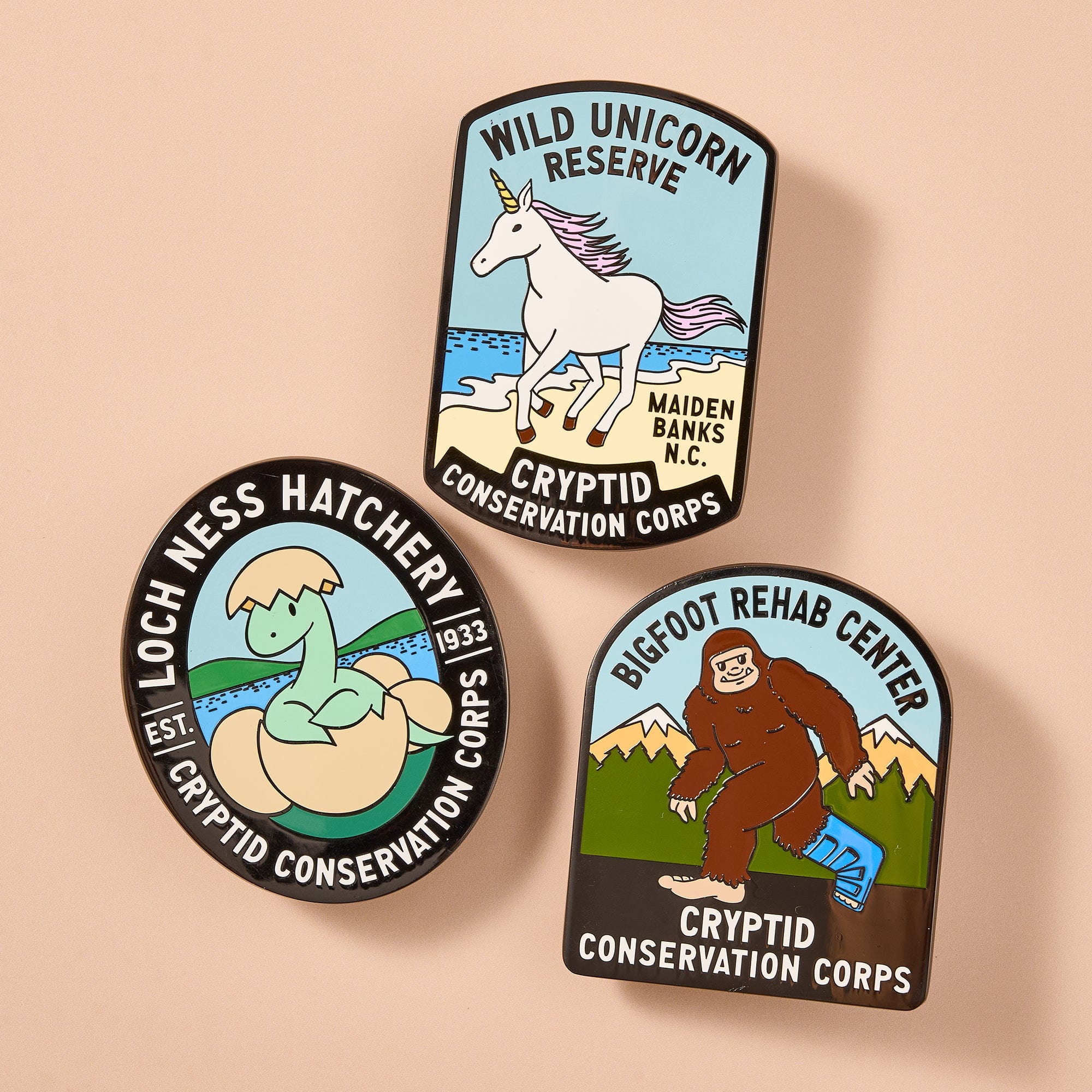 Cryptid Conservation Corps: All Series 1 Patches, Pins, and Stickers Set